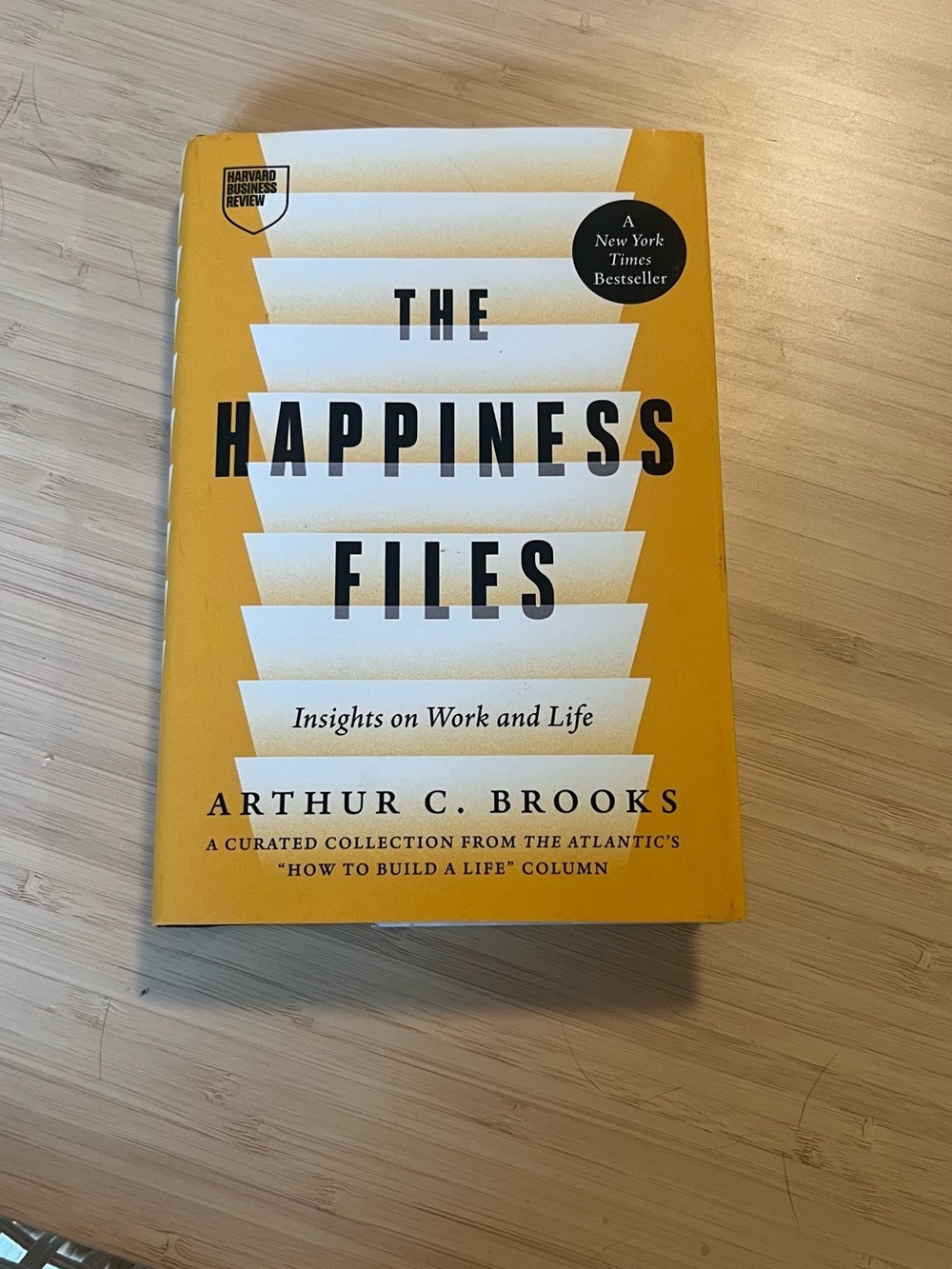 Arthur C. Brooks book hardcover - "The Happiness Files" (Yellow)